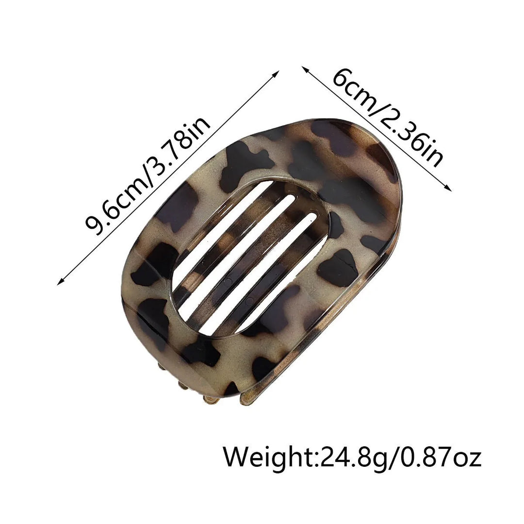 Product dimension graphic showing the flat oval hair claw clip measuring 9.6 cm by 6 cm and weighing 24.8 g