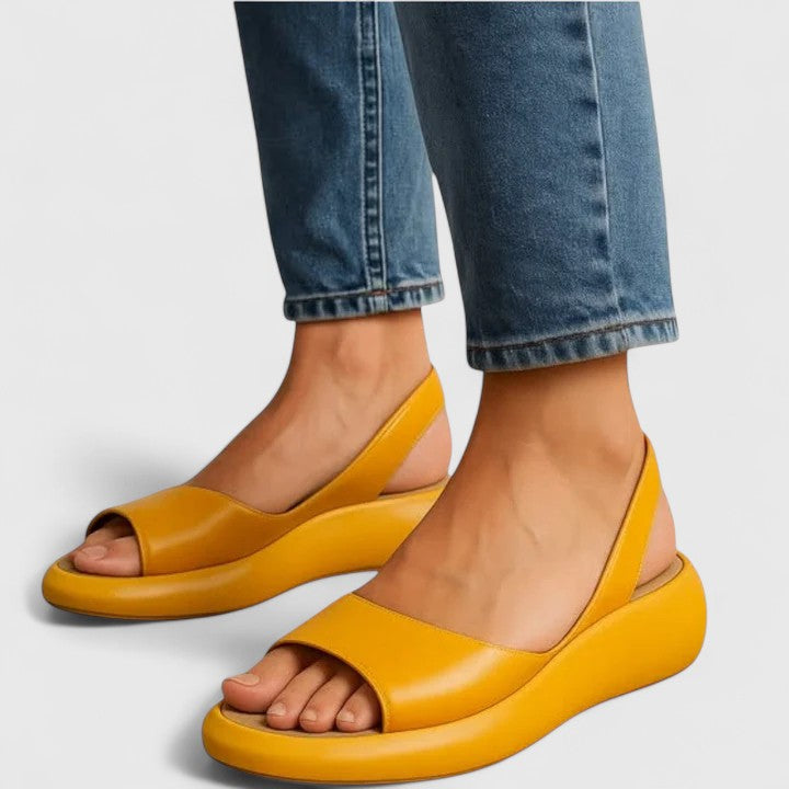 Close up of womens peep toe sandals featuring slingback design