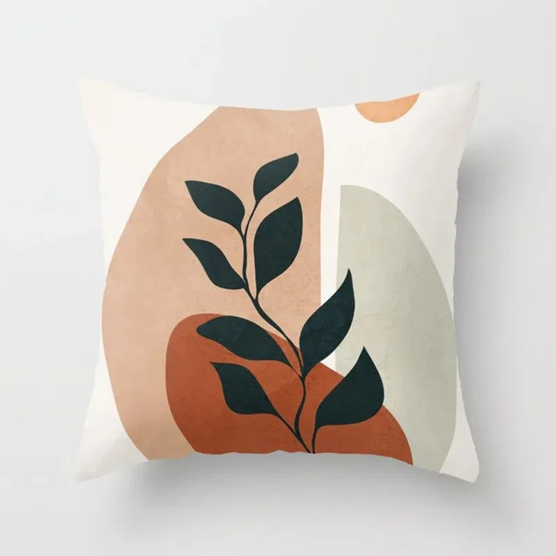 Botanical throw pillow cover featuring modern leaf artwork in earthy tones