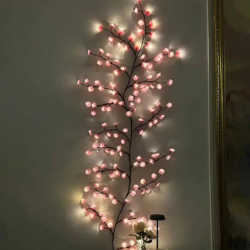 Vertical display of cherry blossom LED string lights mounted straight on an interior wall