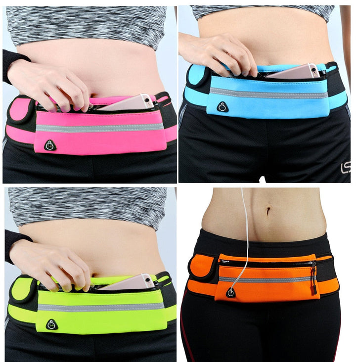Person wearing a pink running belt waist pack with a smartphone inside