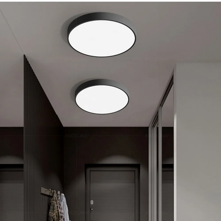 Detailed shot of the diffuser and metal trim on a modern round ceiling lamp