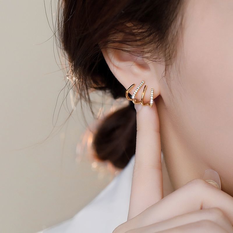 Gold claw hoop ear climber set for women showcasing unique angles