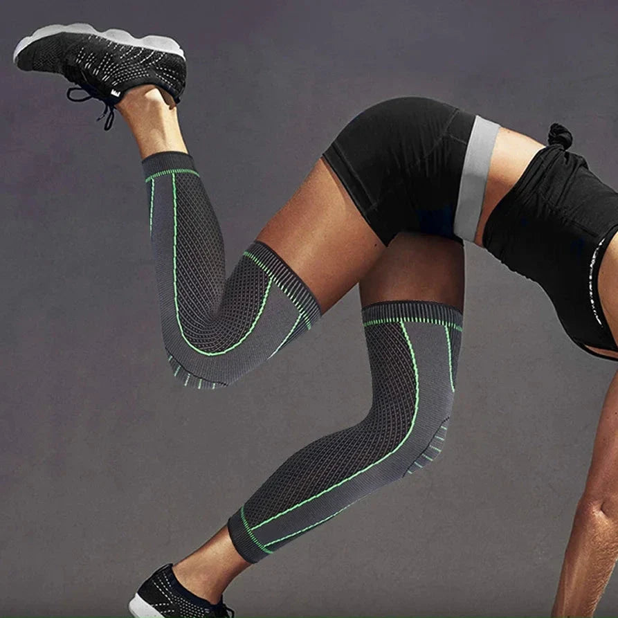 Athletic person demonstrating flexibility while wearing knee support sleeves.