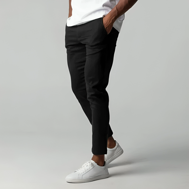 Side profile view of men's modern fit flex chino trousers in black, showing slim leg cut
