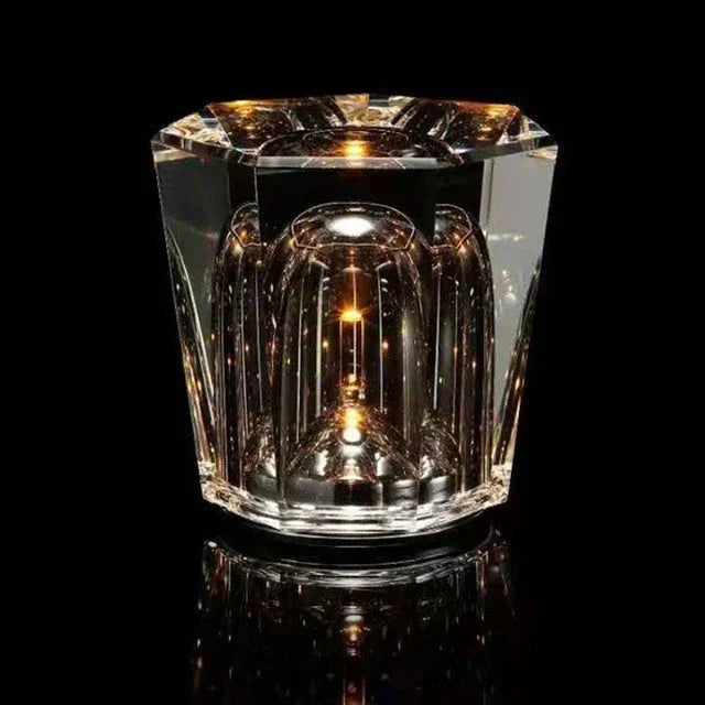 Rechargeable crystal table lamp casting geometric light patterns on a dining table