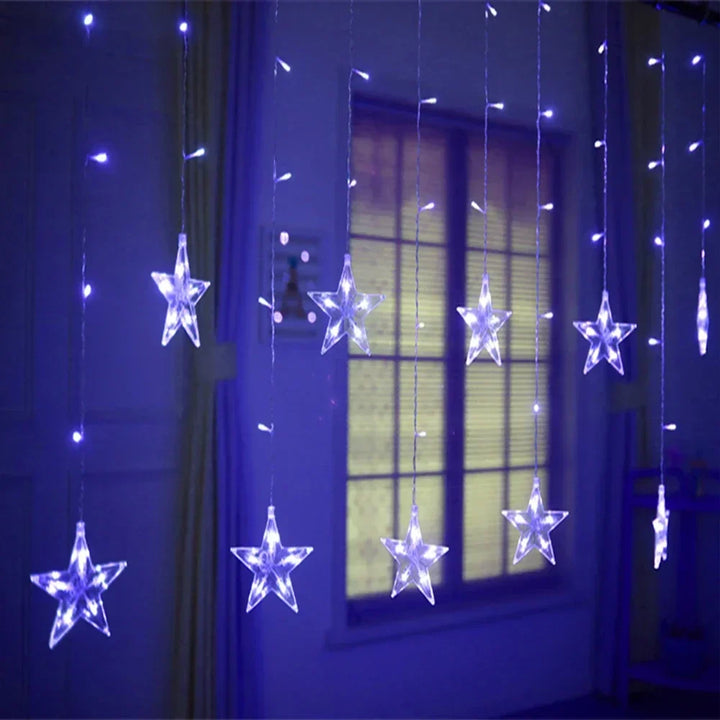 Star shaped LED fairy light garland illuminated for cozy bedroom lighting and home decor