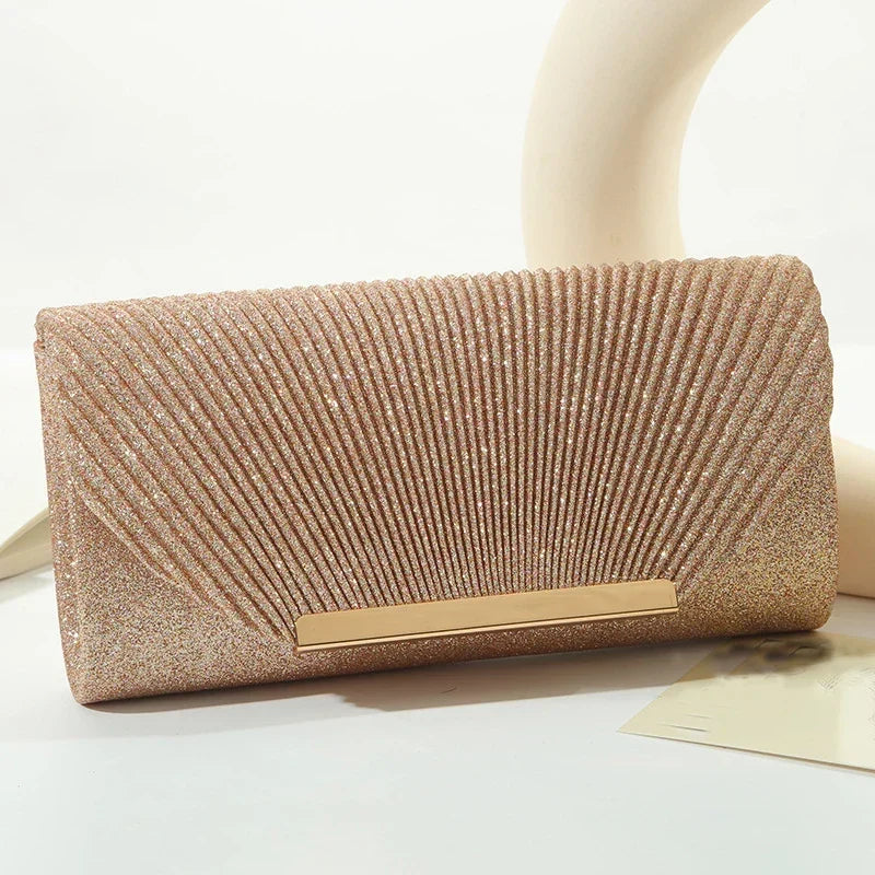 Women's luxury champagne glitter evening clutch handbag on display
