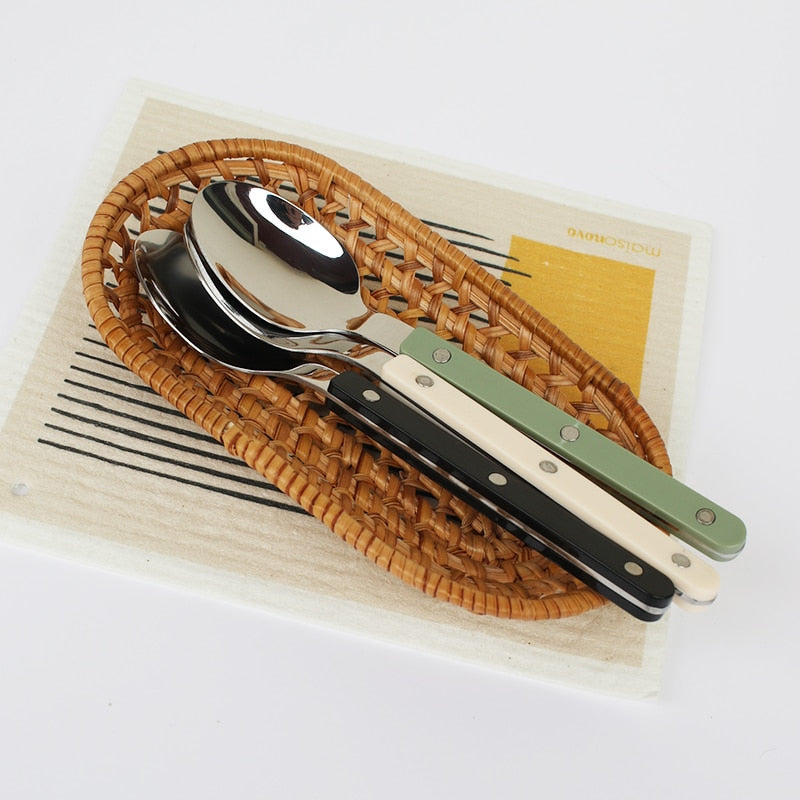 Close-up of polished stainless steel fork and knife from the flatware set