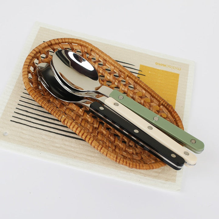 Close-up of polished stainless steel fork and knife from the flatware set