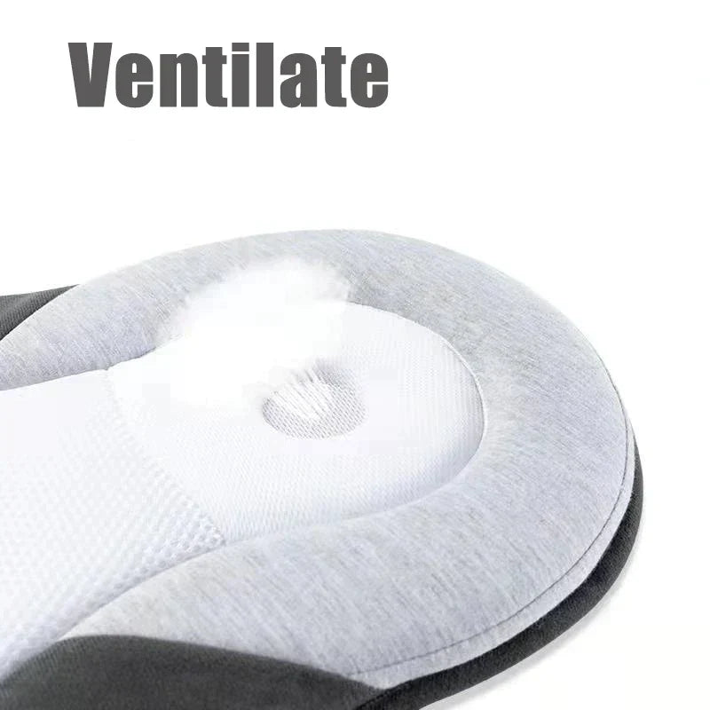 Portable infant support cushion displayed flat on a clean modern nursery floor