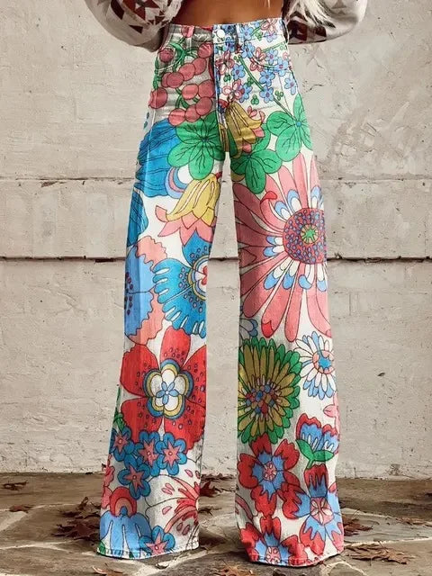 Close-up view of the vibrant botanical print and soft fabric on the women's printed trousers.