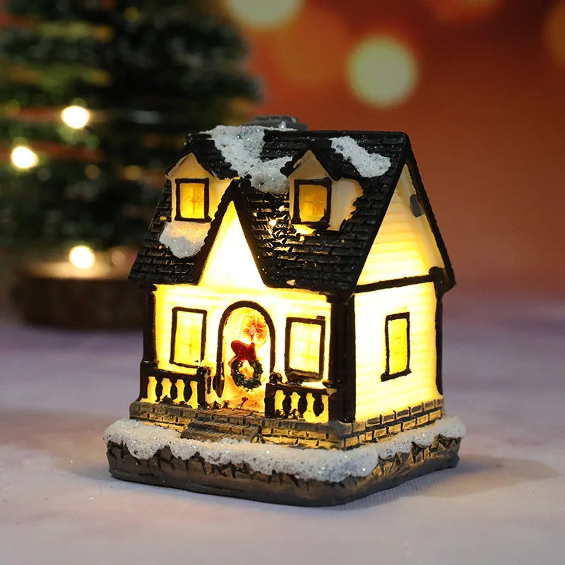 Close-up of lit-up cottage lamp with snow details and warm window glow