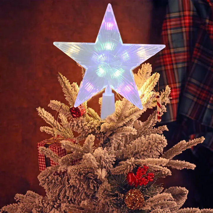 Illuminated Starlit LED tree topper star placed on a snowy Christmas tree