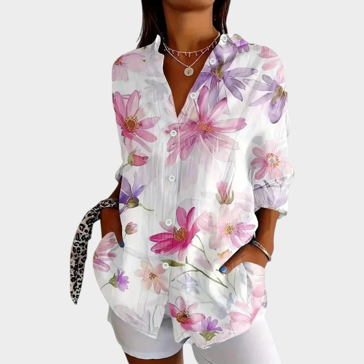 Womens floral botanical button-up blouse showing long sleeves and V-neckline