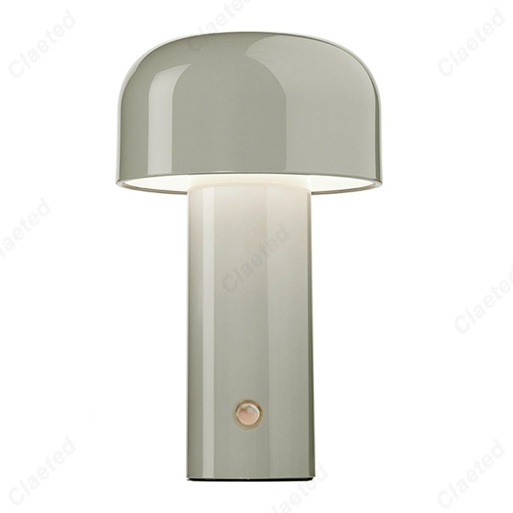 Retro style table lamp illuminated in a dimly lit restaurant or cafe