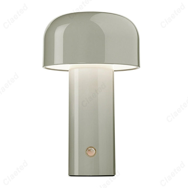 Retro style table lamp illuminated in a dimly lit restaurant or cafe