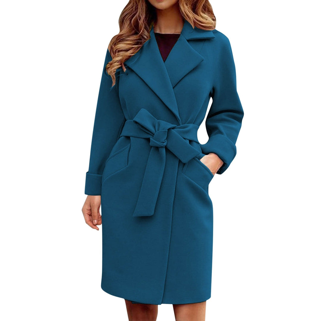 Full view of the stylish women's winter trench coat in vibrant blue on a neutral background
