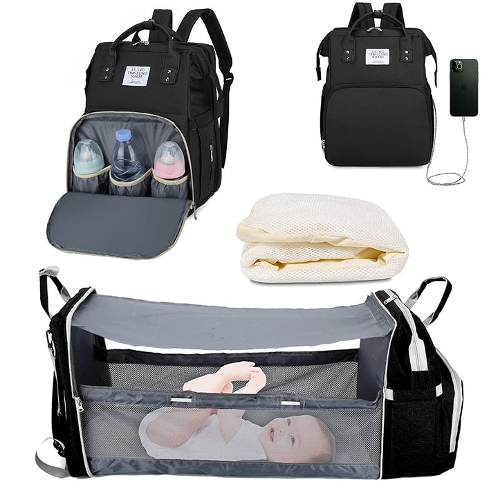 Black baby changing bag backpack with fold-out travel crib and changing mat