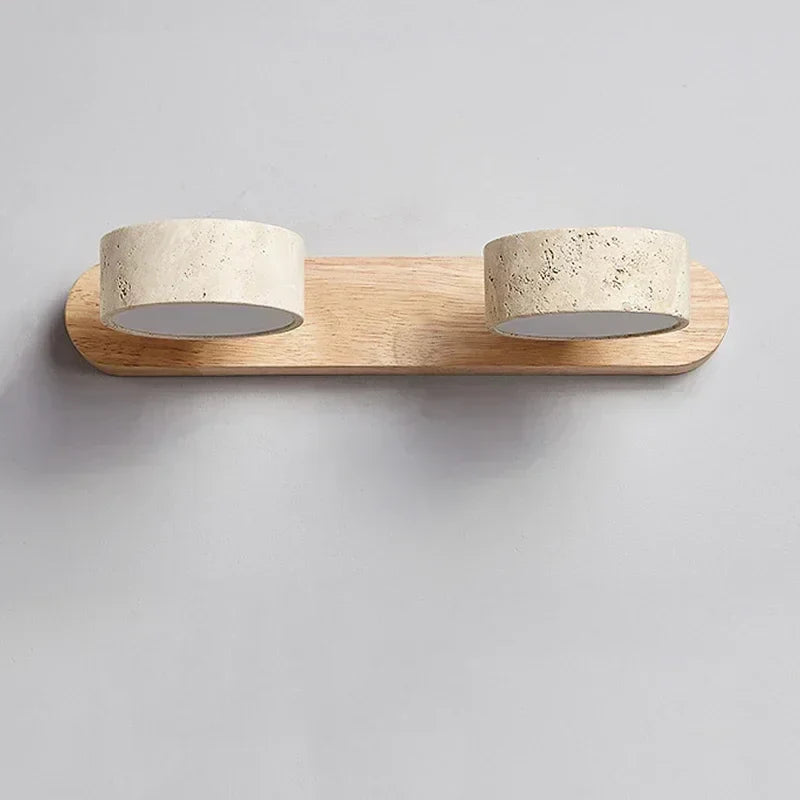 Front view of the modern wall lamp with light wood finish and stone shades