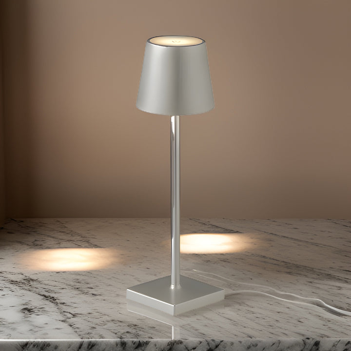 Atmospheric lighting from a rechargeable scandinavian design lamp in living room