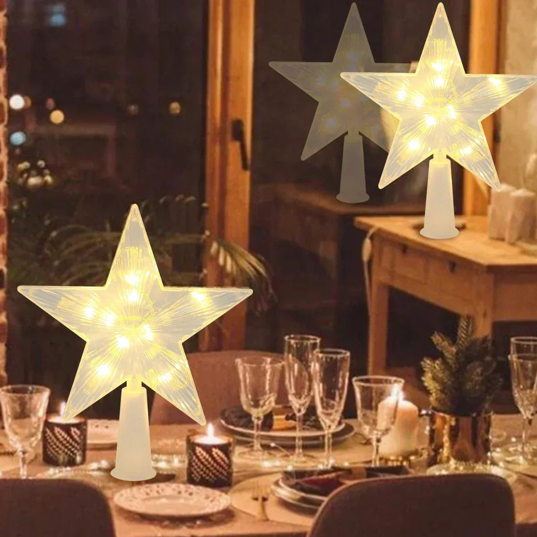 Illuminated LED Christmas tree star topper glowing warmly for winter holiday decor
