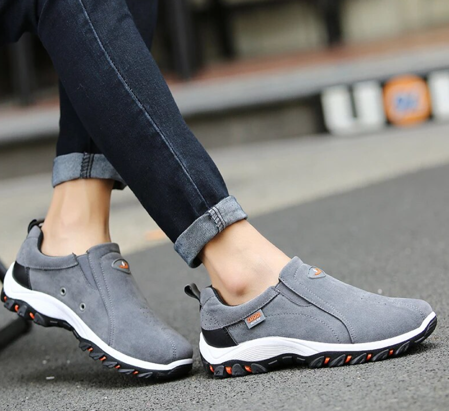 Pair of mens casual comfort footwear styled on a clean background