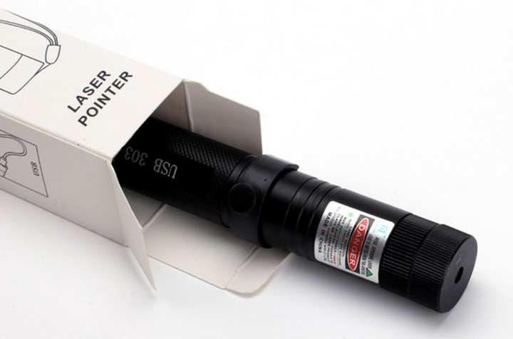 Laser pointer device partially unboxed showing packaging details