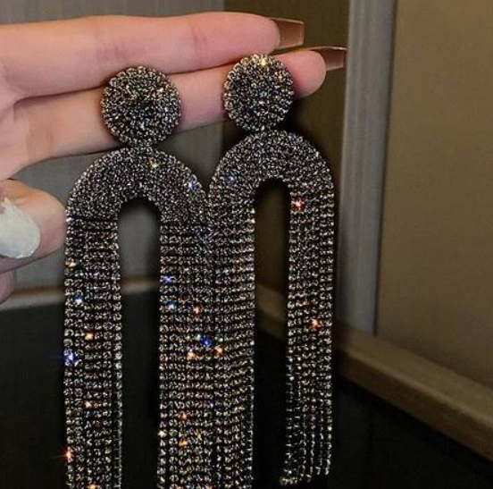 Detailed shot of sparkling crystal facets on statement drop earrings
