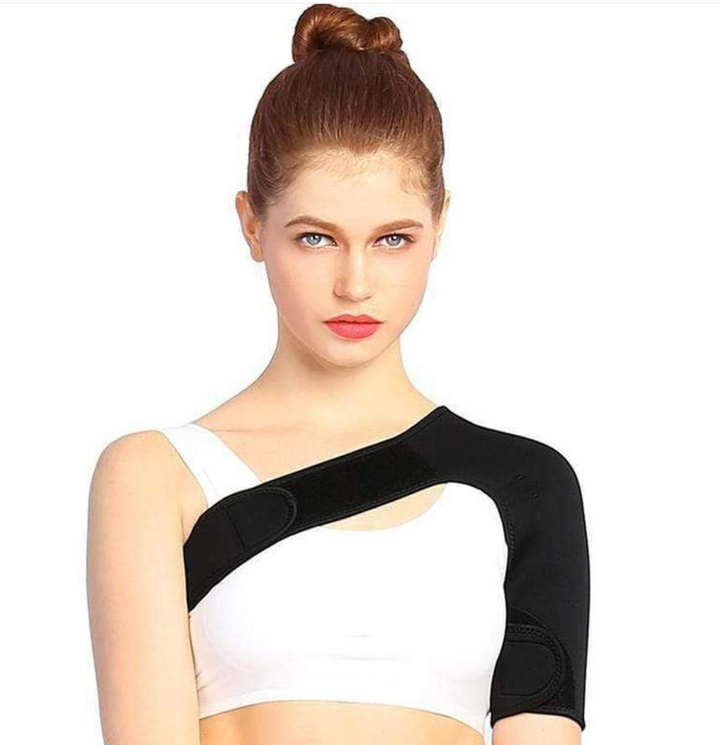 Woman wearing black compression shoulder support sleeve facing forward