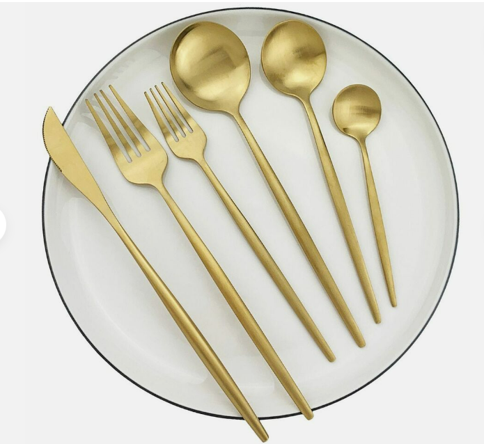 Sleek stainless steel dessert fork part of a complete dining cutlery set