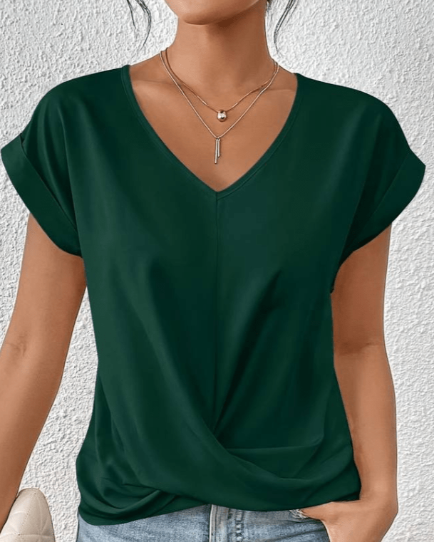 Woman wearing green V-neck twist hem short sleeve summer top