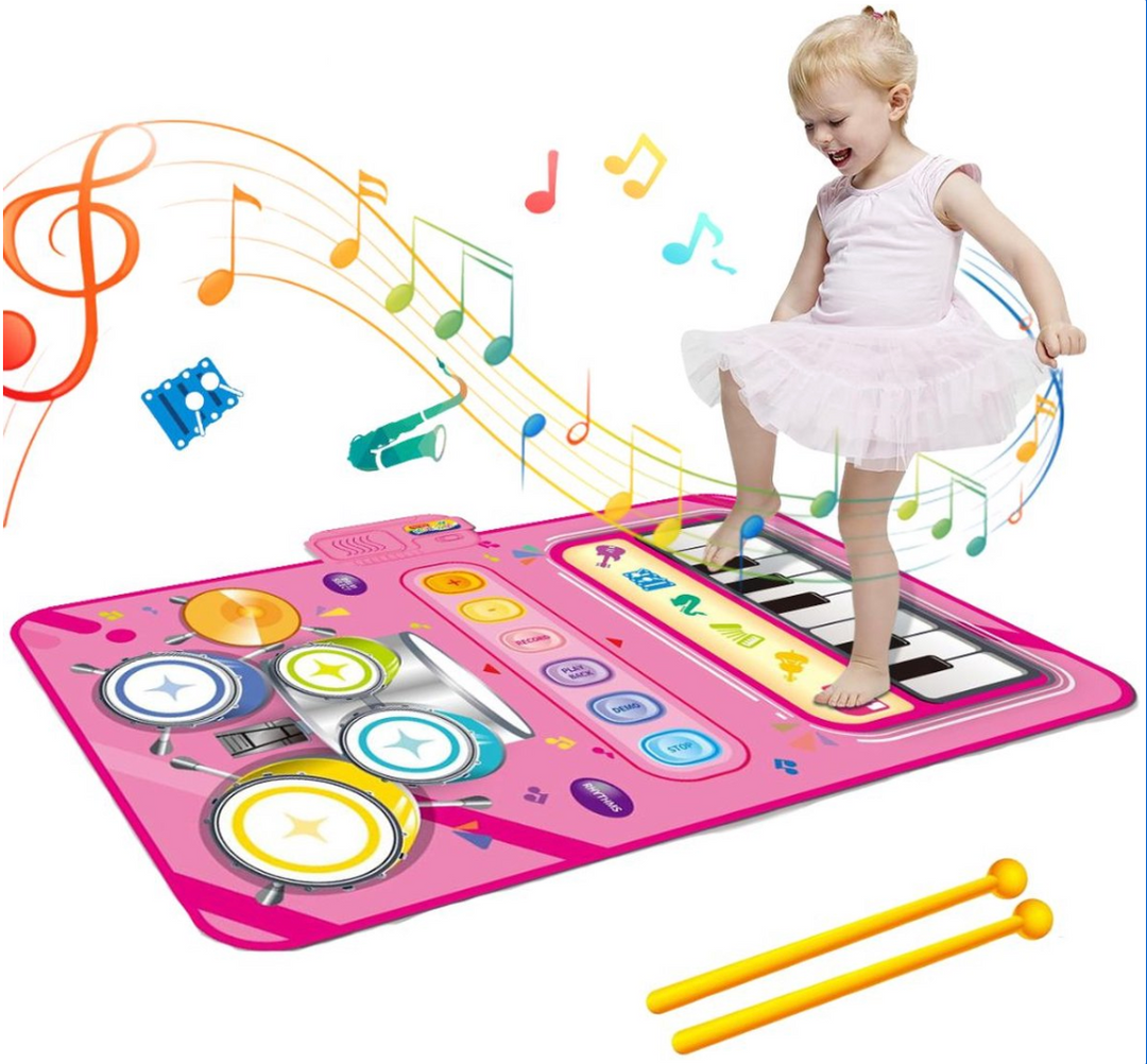 Happy child jumping and playing on the sensory musical floor mat