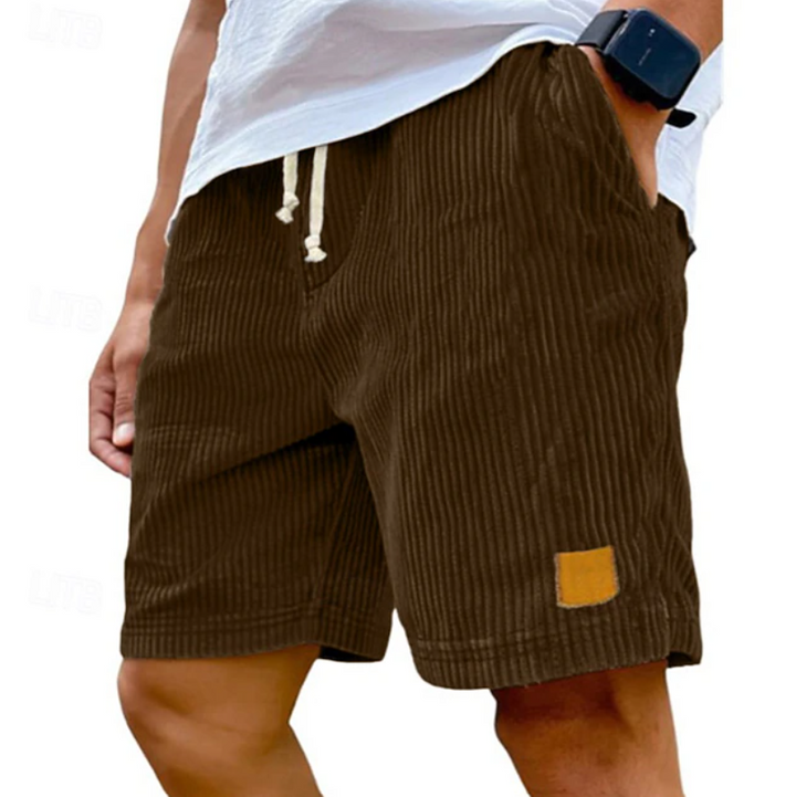 Men's brown textured summer shorts worn with white tee