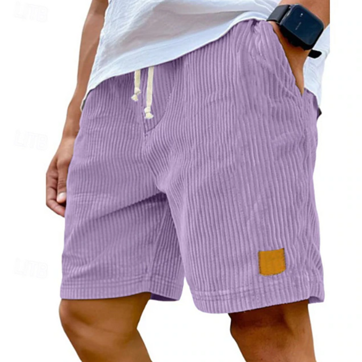 Flat lay of mens fashion summer shorts paired with casual wear items