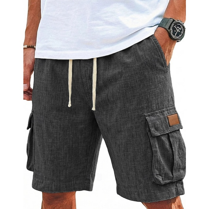 Man wearing grey casual cargo shorts with utility pockets
