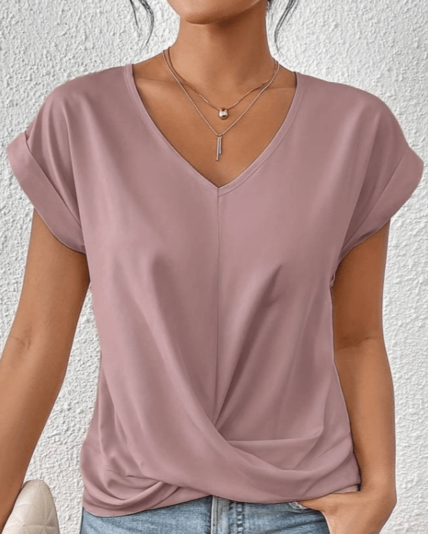Green v-neck short sleeve summer shirt featuring a stylish twist hem detail