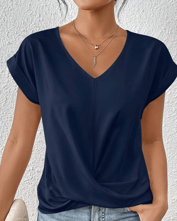 Woman wearing navy V-neck twist hem short sleeve casual t-shirt