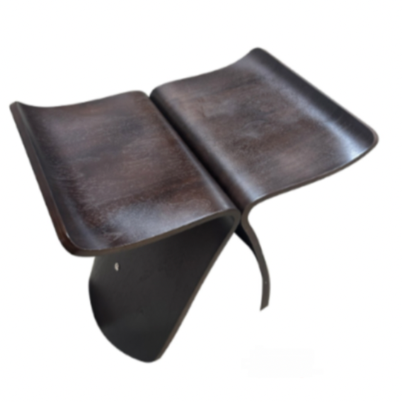 Versatile solid wood stool used as a stylish low side table in a lounge