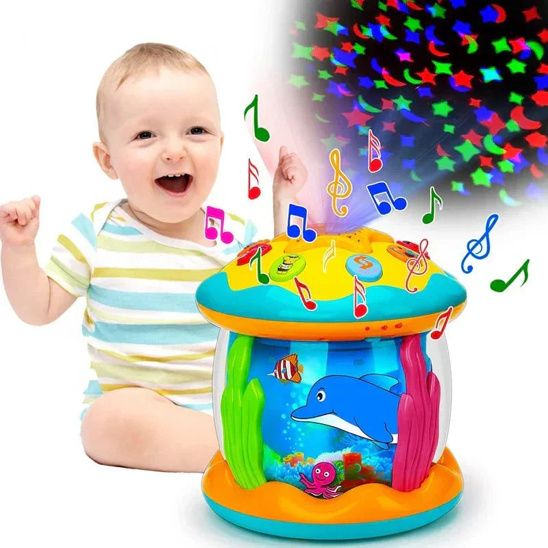 Happy baby smiling next to the TwinkleDrum musical toy with star projections