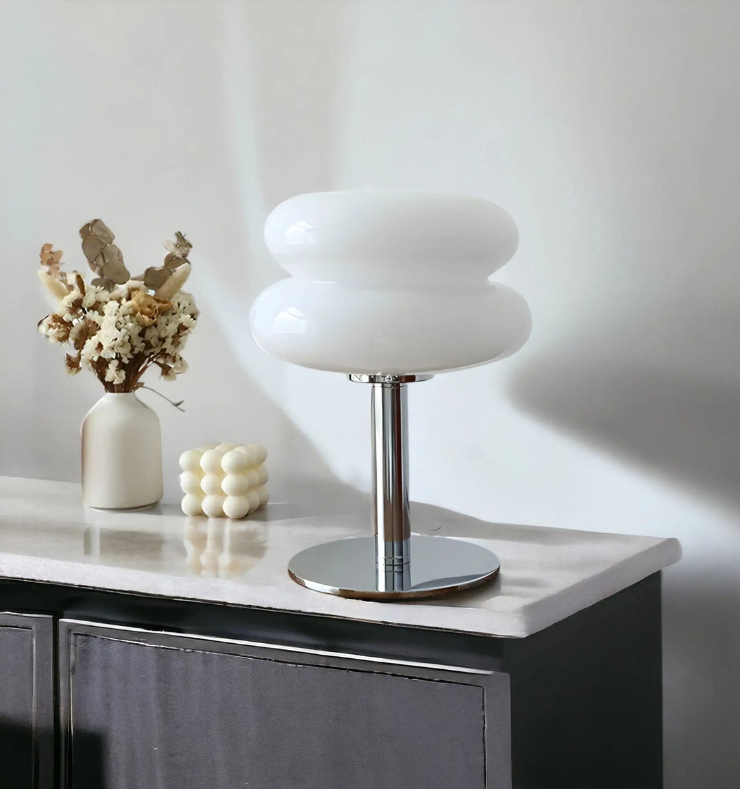 Modern macaron glass desk lamp casting soft bedroom lighting
