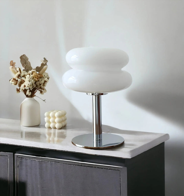 Modern macaron glass desk lamp casting soft bedroom lighting