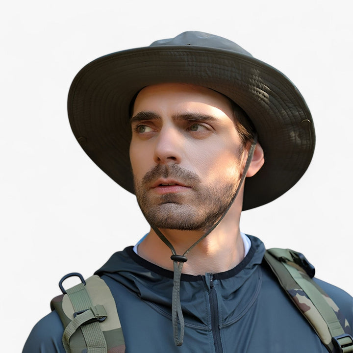 Close-up of man wearing army green waterproof sun hat outdoors