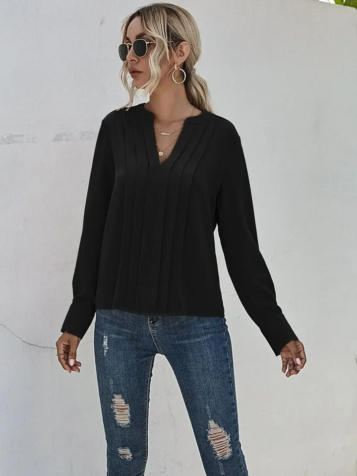 Elegant pleated blouse paired for a sophisticated everyday outfit