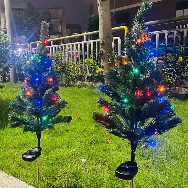 Solar LED Christmas tree garden lights installed in a lawn