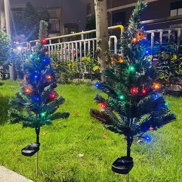Solar LED Christmas tree garden lights installed in a lawn