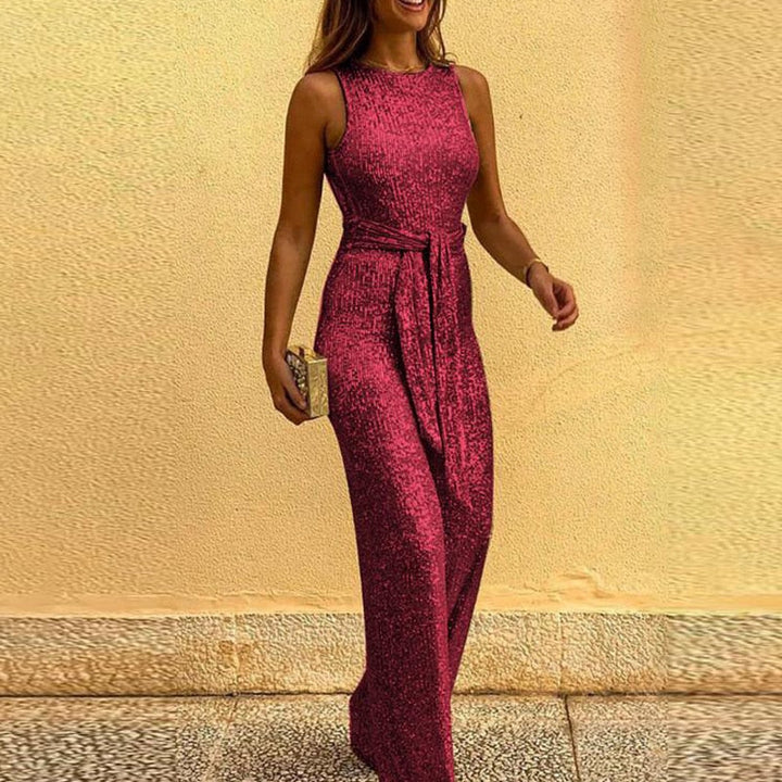 Woman posing in a stunning red evening jumpsuit