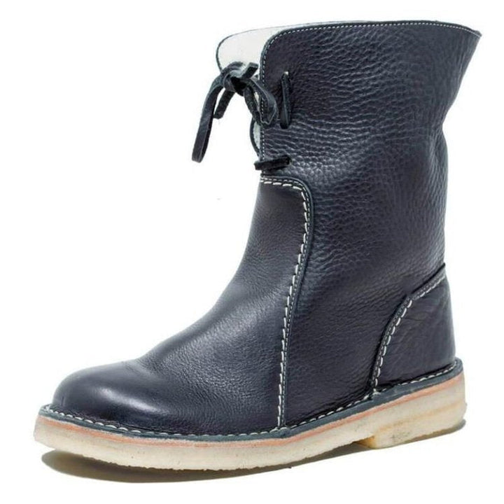 Stylish women's ankle boots paired with winter casual wear outfit