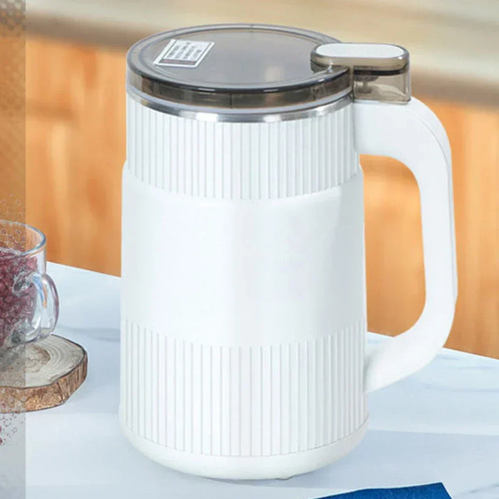 Electric grinder for dry herbs and coffee beans on kitchen counter