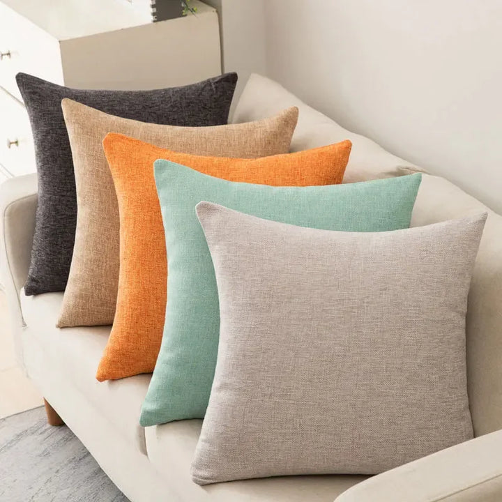 Neutral tone sofa pillow complementing interior home decor themes